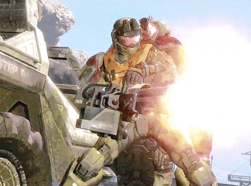 A Man In A Military Uniform Is Holding A Gun In Front Of A Vehicle That Says Step GIF