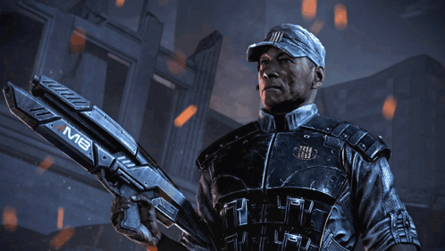 A Man In A Military Uniform Is Holding A Large Gun That Says Mb On It GIF