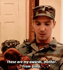 A Man In A Military Uniform Is Holding A Stuffed Animal And Saying These Are My Awards Mother From Army GIF