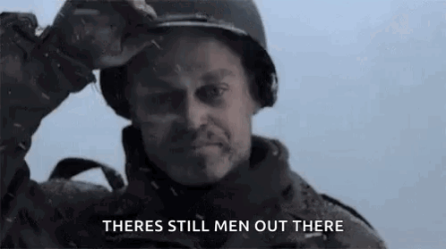 A Man In A Military Uniform Is Holding His Helmet Over His Head And Says `` There 'S Still Men Out There '' . GIF