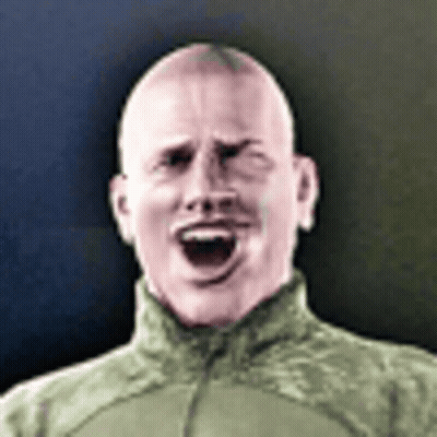 A Man In A Military Uniform Is Making A Funny Face . GIF