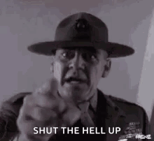 A Man In A Military Uniform Is Pointing His Finger At The Camera And Saying `` Shut The Hell Up '' . GIF