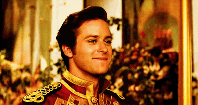 A Man In A Military Uniform Is Smiling In Front Of A Painting . GIF