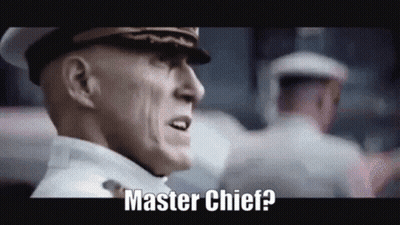 A Man In A Military Uniform Is Standing In Front Of A Crowd And Says Master Chief ? GIF