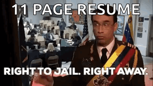 A Man In A Military Uniform Is Standing In Front Of A Room With People Sitting At Desks . GIF