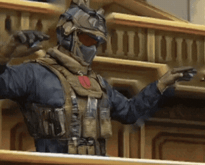 A Man In A Military Uniform Is Standing On A Balcony GIF