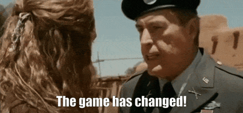 A Man In A Military Uniform Is Talking To A Woman With The Words The Game Has Changed . GIF