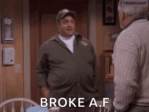 A Man In A Military Uniform Is Talking To Another Man In A Living Room And Says `` Broke A F '' . GIF