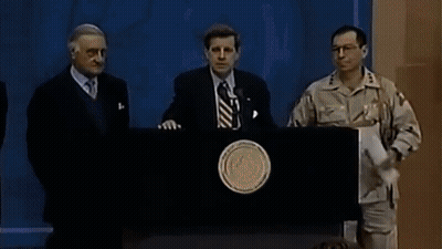 A Man In A Military Uniform Stands At A Podium GIF