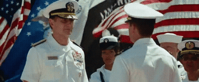 A Man In A Military Uniform Stands In Front Of A Flag That Says Liberty GIF