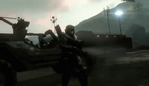 A Man In A Military Uniform Stands In Front Of A Vehicle That Says Y-520-V GIF