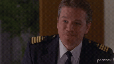 A Man In A Military Uniform With Peacock Written On The Bottom Right GIF