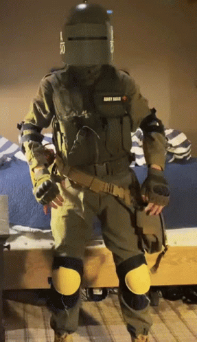 A Man In A Military Uniform With The Word Army On The Back GIF