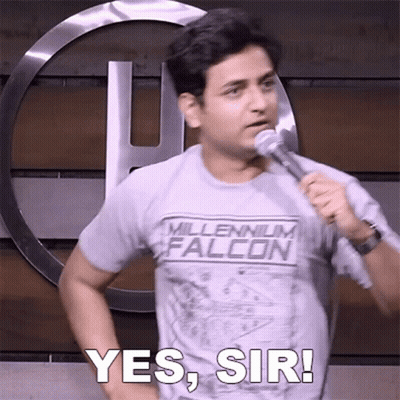 A Man In A Millennium Falcon Shirt Is Holding A Microphone And Says Yes Sir GIF