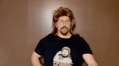 A Man In A Mullet And Glasses Is Wearing A Shirt That Says " Bill Riga " GIF