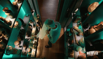 A Man In A Museum With A Netflix Logo On The Bottom Right GIF
