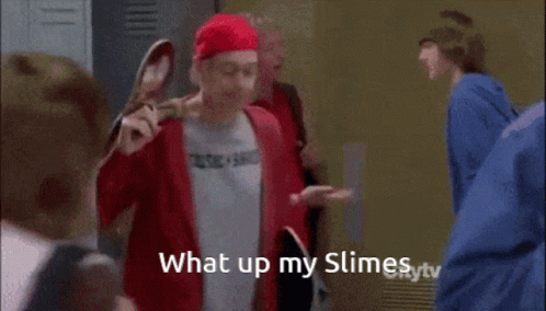 A Man In A Music Band Shirt Is Holding A Skateboard Over His Shoulder GIF