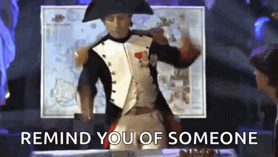 A Man In A Napoleon Costume Is Dancing With The Words Remind You Of Someone Behind Him GIF