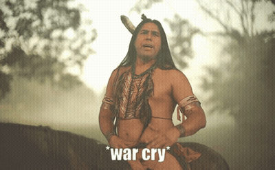 A Man In A Native American Outfit Is Riding A Horse With The Words " War Cry " Written Below Him GIF
