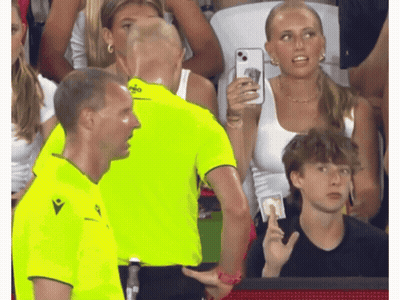 a man in a neon yellow shirt with the word macron on the front