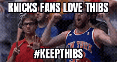 A Man In A New York Knicks Jersey Is Cheering GIF