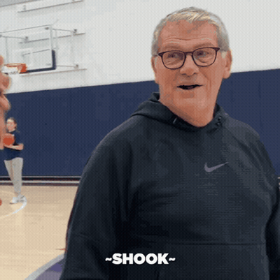 A Man In A Nike Hoodie Says Shook GIF
