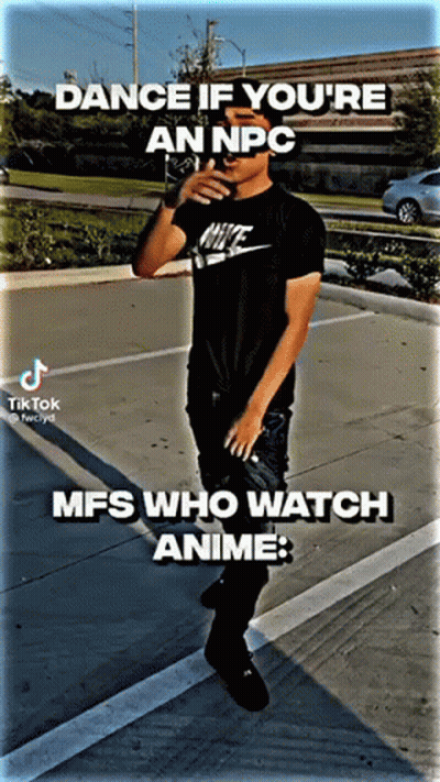 A Man In A Nike Shirt Is Standing In A Parking Lot . GIF