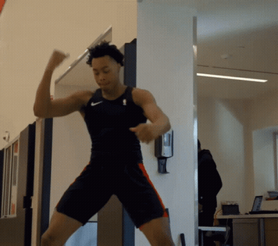A Man In A Nike Tank Top And Shorts Is Dancing GIF