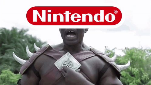 A Man In A Nintendo Costume Is Holding A Coin GIF