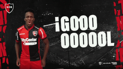A Man In A Nob Jersey Stands In Front Of A Soccer Field GIF