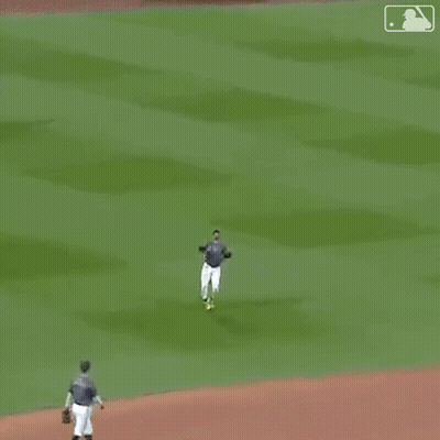 A Man In A Nyc Jersey Is Dancing On The Field . GIF