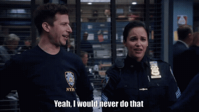 A Man In A Nypd Shirt Is Talking To A Woman GIF