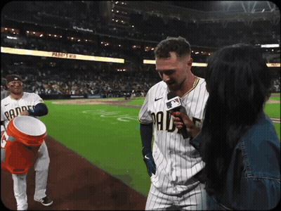 A Man In A Padres Uniform Is Being Interviewed GIF
