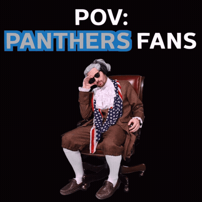 A Man In A Panthers Costume Sits In A Chair GIF