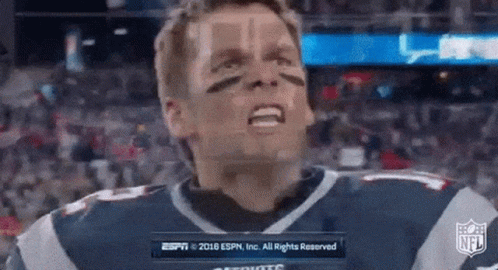 A Man In A Patriots Jersey Is Making A Funny Face In Front Of A Nfl Logo . GIF