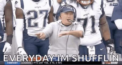 A Man In A Patriots Jersey Stands In Front Of A Group Of Football Players GIF