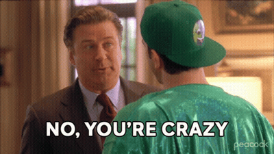 A Man In A Peacock Shirt Is Talking To Another Man GIF