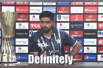 A Man In A Pepsi Shirt Stands In Front Of A Trophy And Says Definitely GIF