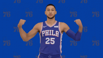 A Man In A Philadelphia 25 Jersey Flexes His Muscles GIF