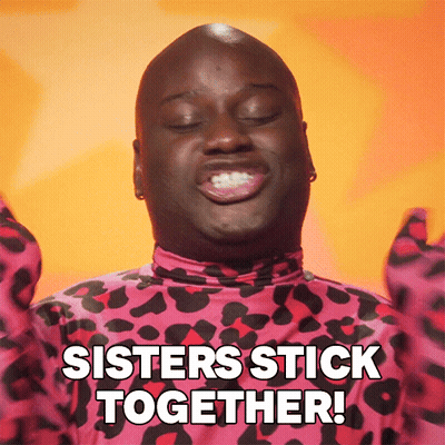 A Man In A Pink And Black Leopard Print Shirt Is Saying Sisters Stick Together GIF
