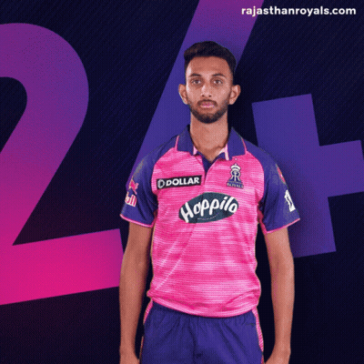 A Man In A Pink And Blue Jersey With The Word Hoppito On The Front GIF