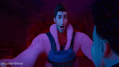 A Man In A Pink Coat Is Talking To Another Man In A Dark Room With #Spiderverse Written In The Corner GIF