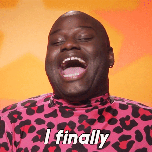A Man In A Pink Leopard Print Shirt Is Laughing And Saying " I Finally " GIF
