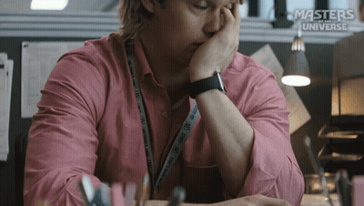 A Man In A Pink Shirt Is Sitting At A Desk With Masters Of The Universe Written On The Bottom GIF