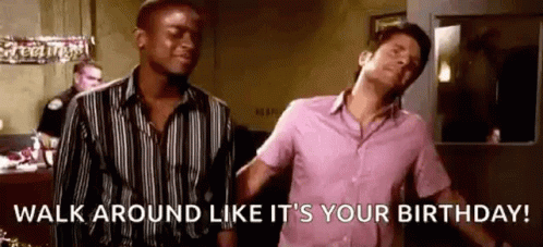 A Man In A Pink Shirt Is Standing Next To Another Man In A Black And White Striped Shirt . GIF