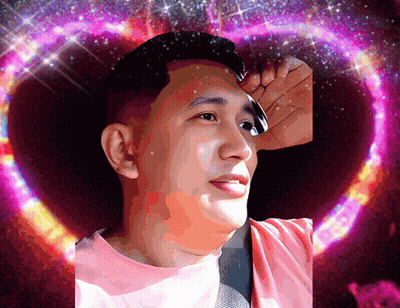 A Man In A Pink Shirt Stands In Front Of A Heart Shaped Background GIF
