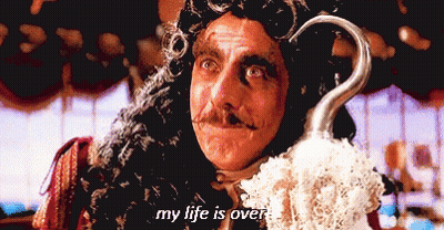 A Man In A Pirate Costume Is Holding A Hook And Says " My Life Is Over " GIF
