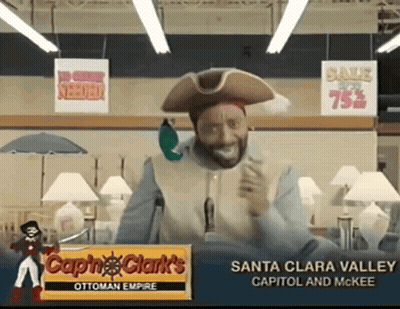 A Man In A Pirate Costume Stands In Front Of A Santa Clara Valley Sign GIF
