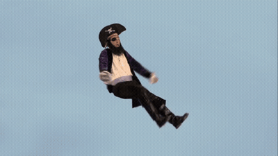 A Man In A Pirate Outfit Is Falling Through The Air GIF