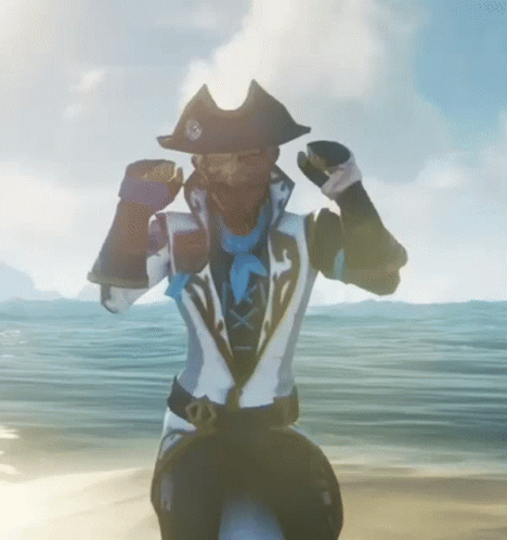 A Man In A Pirate Outfit Is Standing On A Beach With His Arms Outstretched . GIF